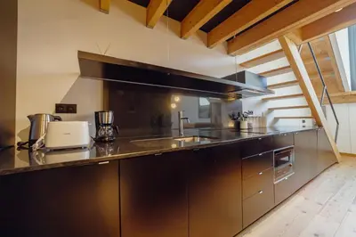 a kitchen with a sink and a counter top at Elegant Downtown Apartment by Vacationy in Porto