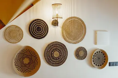 a wall with several decorative plates on a wall at Elegant Downtown Apartment by Vacationy in Porto
