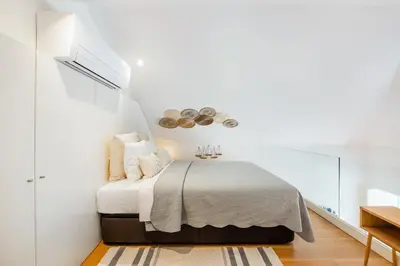 a living room with a couch and a table at Porto Loft Living in Porto