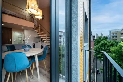 a room with a balcony with a table and chairs at Paraíso Apartment by Amber Star Rent in Porto