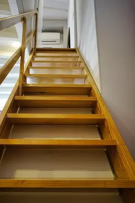 a set of wooden stairs in a room at WLoft in Vila Nova de Gaia