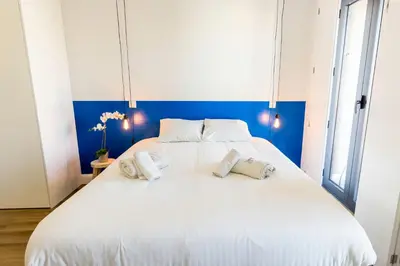 a large white bed with two pillows on it at Guest H4U - Porto Bonfim Heroismo in Porto