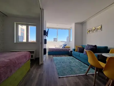 a room with a bed and a couch and a table at Hey Porto Apartment in Porto