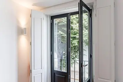a glass door with a view of a balcony at Lapa Flat in City Center by LovelyStay in Porto