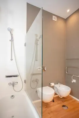 a bathroom with a shower and a toilet and a sink at Liiiving in Gaia - Douro Dream View in Vila Nova de Gaia