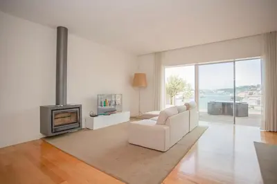 a living room with a couch and a fireplace at Liiiving in Gaia - Douro Dream View in Vila Nova de Gaia