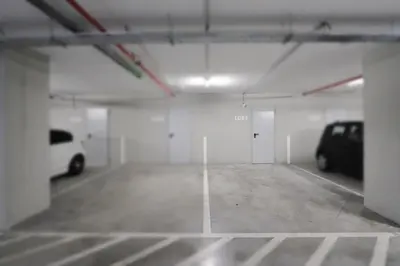 a parking garage with a car parked in it at HM - Casa Ghiselini Porto 214 in Porto