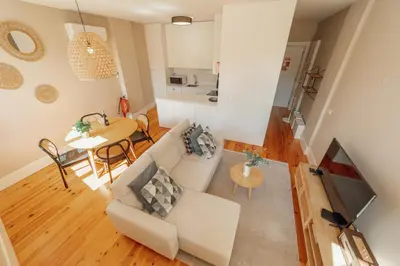 a living room with a couch and a table at Boavista Premium Apartments by Vacationy in Porto