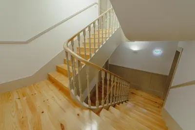 a staircase in a house with wooden floors at Legacy Oporto Premium Apartments by Vacationy in Porto