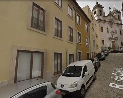 a group of cars parked next to a building at Davis Home, Refúgio de Charme no Porto in Porto