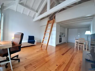 a room with a desk and a ladder in a loft at Porto Vista by Flat in Porto in Porto