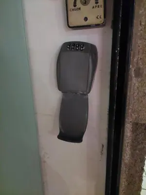 a black object is hanging on a wall at charming loft in Porto in Porto