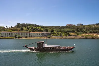 a boat in the water on a river at Away to Enjoy Apartment - hapiness has a place in Porto