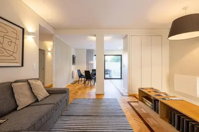 a living room with a couch and a table at Casa do Ofício Galerista in Porto