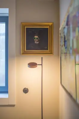 a room with a refrigerator with a picture on the wall at 62 Design House II in Porto