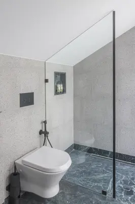 a bathroom with a toilet and a glass shower at 62 Design House II in Porto