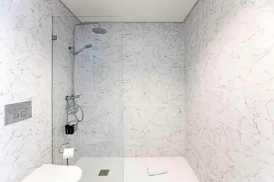 a bathroom with a shower and a toilet at NEW Cozy and Modern Apartment in the heart of Porto in Porto