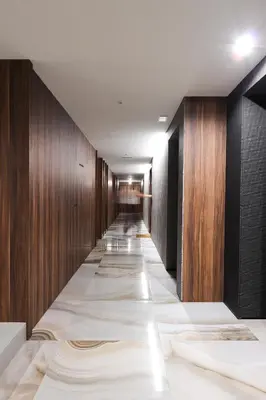 a corridor with wooden walls and a long hallway with white tiles at HM - Casa Ghiselini Porto 213 in Porto