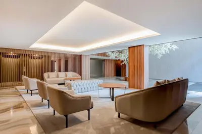 a living room with a couch and chairs at HM - Casa Ghiselini Porto 215 in Porto