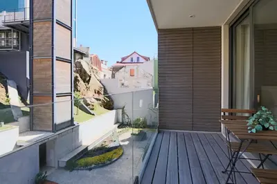a balcony of a house with a wooden deck at HM - Casa Ghiselini Porto 215 in Porto