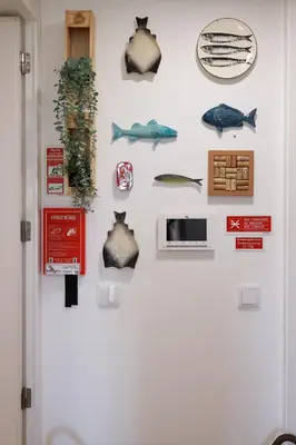 a wall with different types of fish on it at Cedofeita Charming Flat in Porto