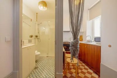 a bathroom with a shower and a sink and a toilet at Downtown Modern Studio With Terrace by Vacationy in Porto