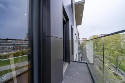a balcony with a view of a city at Trindade Duplex by Amber Star Rent in Porto