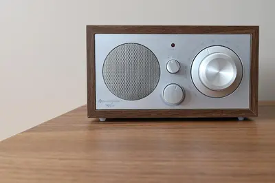 a small radio sitting on top of a wooden table at Music Apartment I in Porto