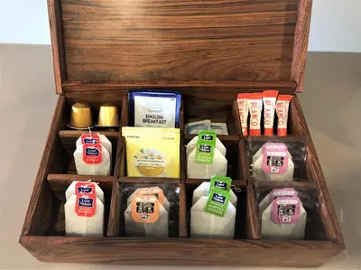 a wooden box filled with different types of towels at Music Apartment I in Porto