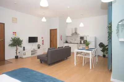 a living room with a couch and a table at Bonsai Apartment III in Porto