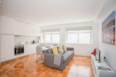 a living room with a couch and a table at Liiiving in Porto - Sunny Santa Catarina in Porto