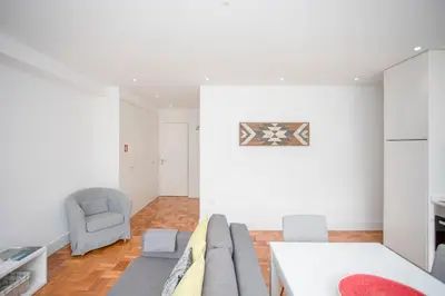 a living room with a couch and a chair at Liiiving in Porto - Sunny Santa Catarina in Porto