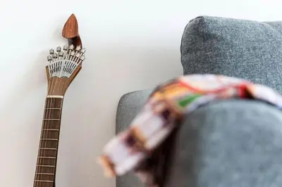 a guitar next to a couch with a toy toy at Loulé 246 · 1 bedroom apartment · Parking in Porto