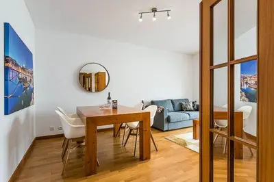 a living room with a table and a couch at Loulé 246 · 1 bedroom apartment · Parking in Porto