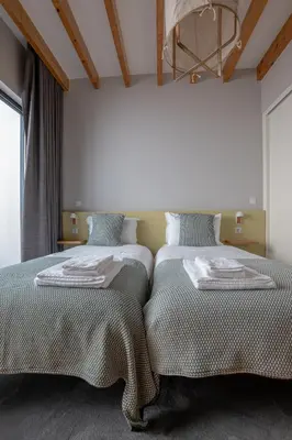two beds sitting next to each other in a bedroom at Oporto Trendy Formosa in Porto