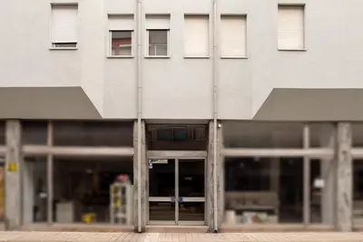 a building with an open door in front at Alegria Flat City Center with Elevator by Vacationy in Porto