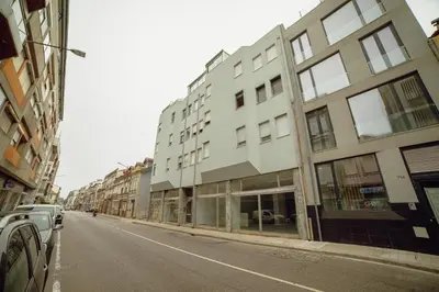 an empty street with buildings on the side of the road at Alegria Flat City Center with Elevator by Vacationy in Porto