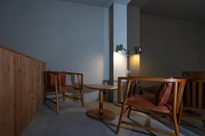 a room with two chairs and a table and a lamp at ICON Duplo Ribeira in Porto
