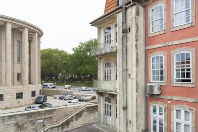 a view of a parking lot between two buildings at Virtudes Flat in Porto