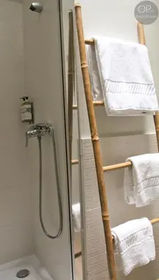 a bathroom with a shower with a glass door at 115 OPorto Guest House in Porto