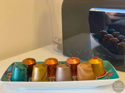a tray of chocolates on a plate next to a microwave at 115 OPorto Guest House in Porto
