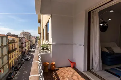 an apartment balcony with a view of a city at Metro Lapa House with sunny balcony and A/C in Porto