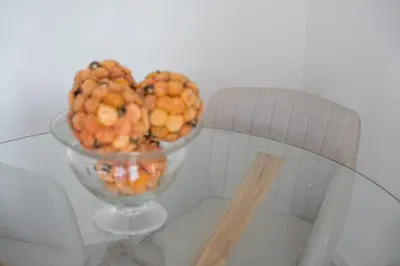 a bowl of fruit on a table next to a chair at GuestReady - Amazing stay near Cedofeita Church in Porto