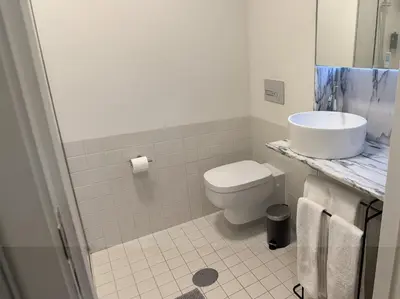 a white bathroom with a sink and a toilet at Atayde da Câmara - Porto in Porto
