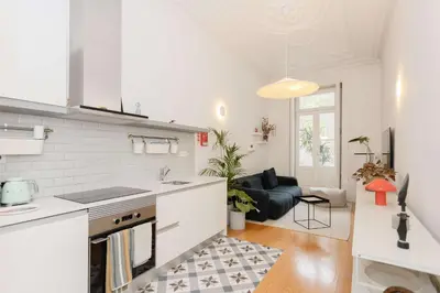 a kitchen and living room with a stove top oven at Liiiving in Porto - Downtown Secret Terrace in Porto