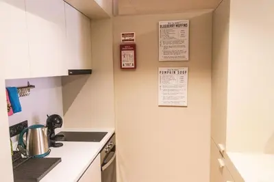a kitchen with a stove and a counter top at São Lázaro's Garden - Apartment With Terrace in Porto