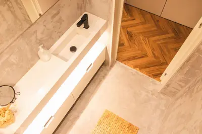 a bathroom with a white tub and a sink at São Lázaro's Garden - Apartment With Terrace in Porto