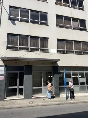 two people standing in the doorway of a building at Casa Anibal artistic Centrally located comfortable affordable in Porto