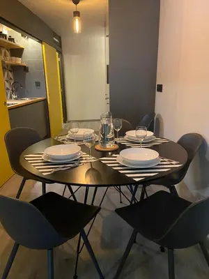 a dining room table with plates and wine glasses on it at Casa Anibal artistic Centrally located comfortable affordable in Porto