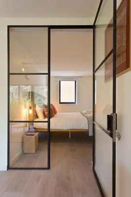 a living room with a table and chairs at Zen Garden Studio B in Porto